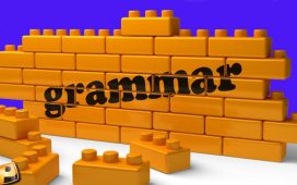 The word grammar printed across a wall of toy Lego-like blocks