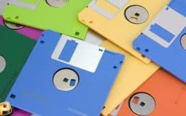 A collection of colored plastic floppy disks for older computers.