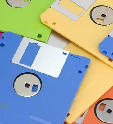 A collection of colored plastic floppy disks for older computers.